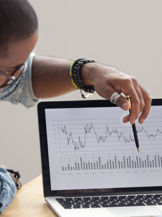 Focused,African,Analyst,Showing,Client,Or,Colleague,Annual,Financial,Report