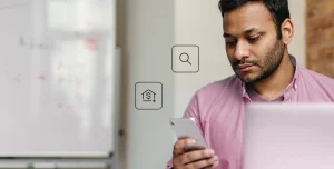 Fotomontagem de homem observando a tela de seu celular, com ícones de busca e de finanças na imagem. que ilustra este artigo sobre o melhor banco digital para abrir conta PJ